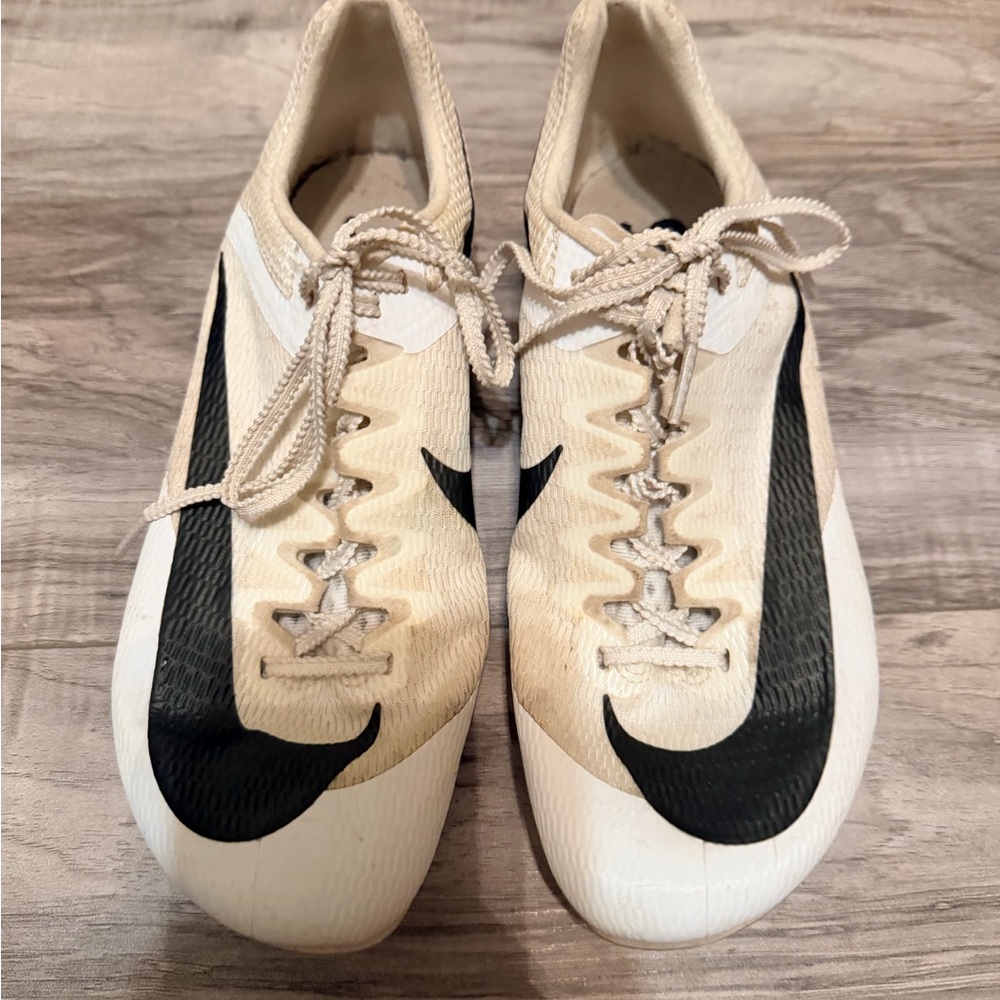 Nike Cream and Black Soccer Cleats with Bold Swoosh
